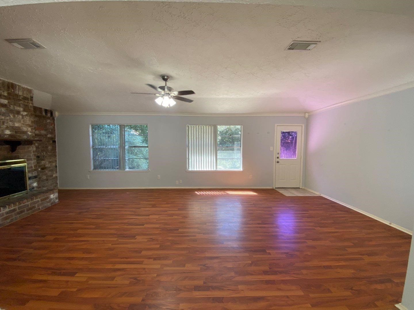 6406 Brookgate Drive Spring, TX 77373 - Photo 5 of 28 an empty room with windows and fireplace