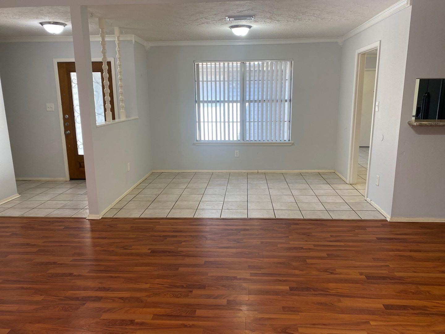 6406 Brookgate Drive Spring, TX 77373 - Photo 6 of 28 an empty room with wooden floor and windows