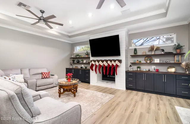 a bedroom with a bed window and a flat screen television