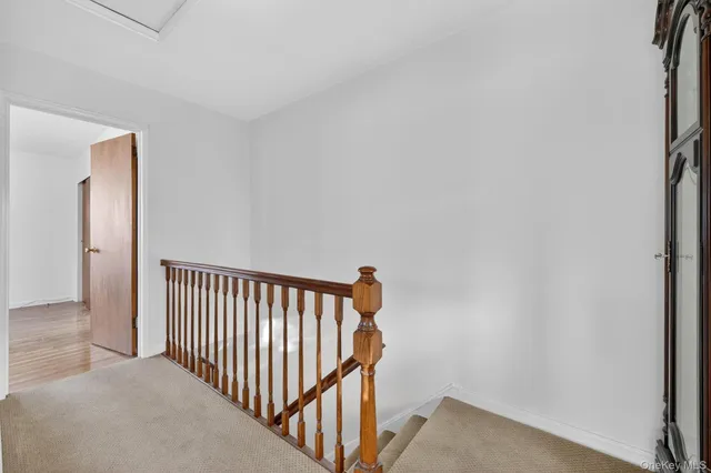 a view of a hallway with a window