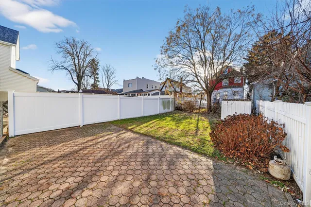 a view of backyard with large trees