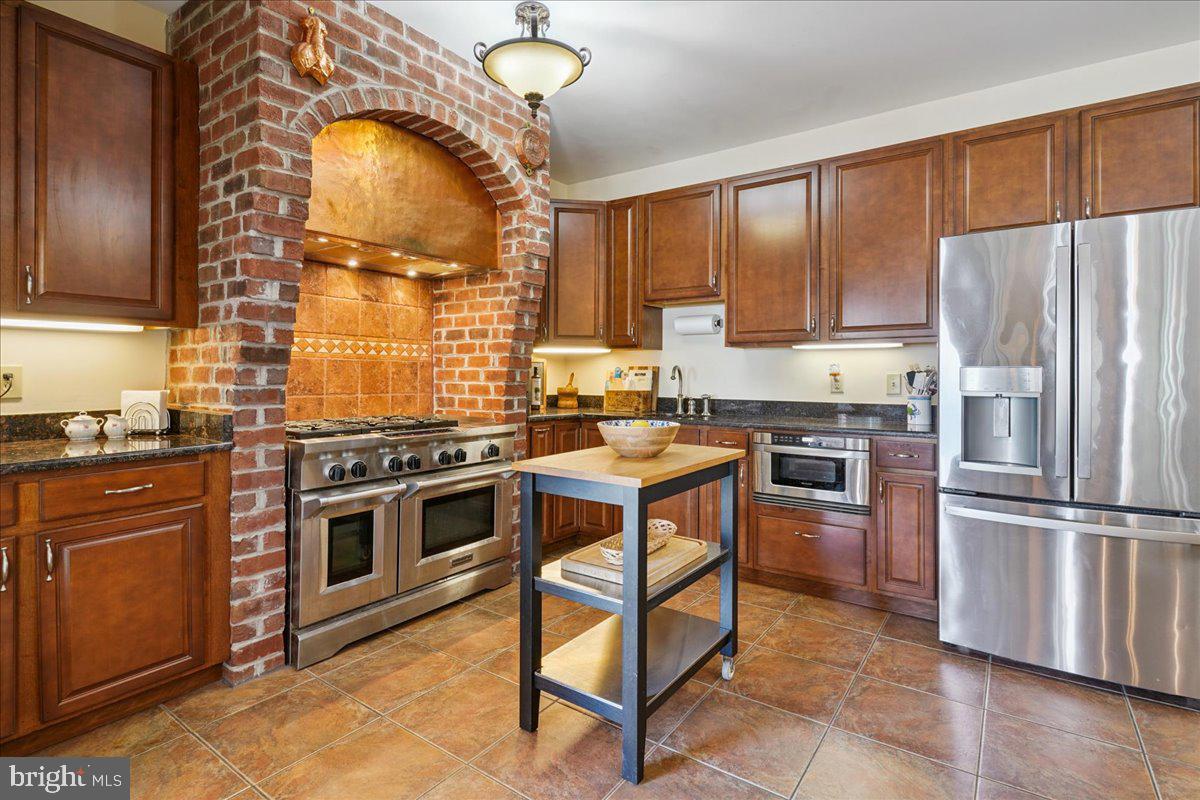 12195 Potomac View Road Newburg, MD 20664 - Photo 31 of 91 a kitchen with stainless steel appliances granite countertop a stove a sink and a refrigerator