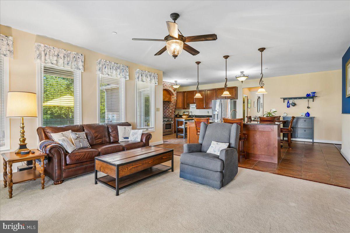 12195 Potomac View Road Newburg, MD 20664 - Photo 35 of 91 a living room with furniture kitchen view and a chandelier