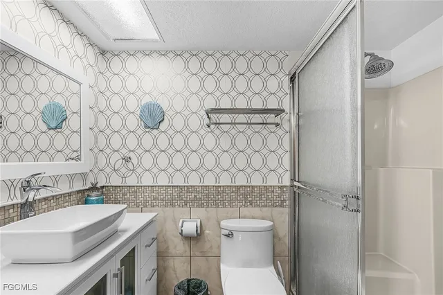 a kitchen with a table and chairs in it