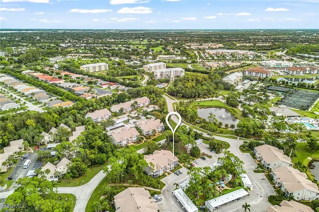 a view of an chairs and table in backyard