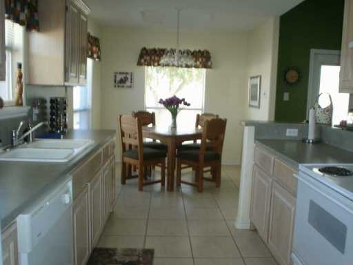 13965 Windjammer Drive Corpus Christi, TX 78418 - Photo 6 of 10 a dining table chair with a granite counter top