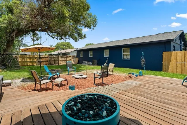 a view of a backyard with a patio