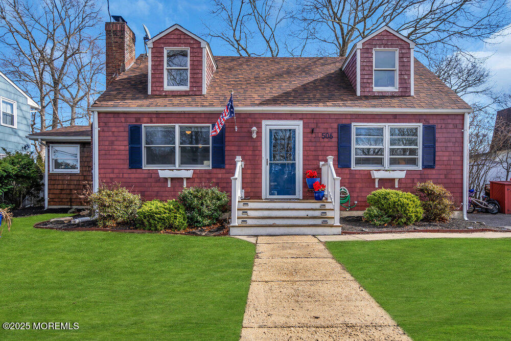 506 Crestview Terrace Point Pleasant, NJ 08742 - Photo 1 of 24 a front view of a house with garden