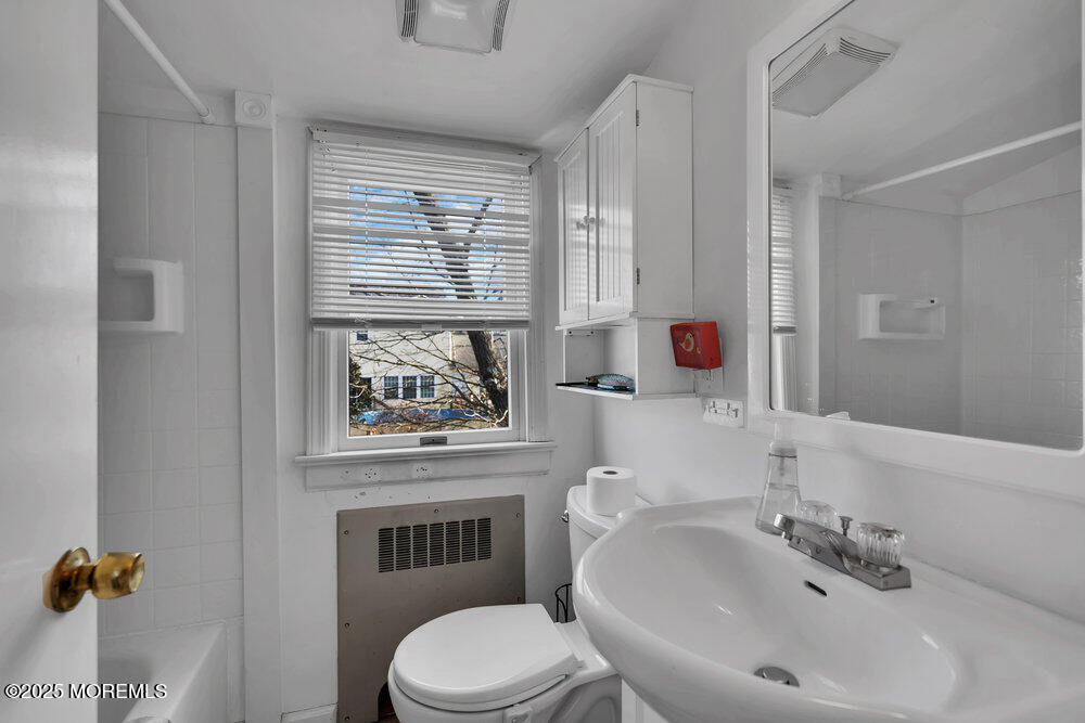 506 Crestview Terrace Point Pleasant, NJ 08742 - Photo 14 of 24 a bathroom with a sink a toilet and a mirror