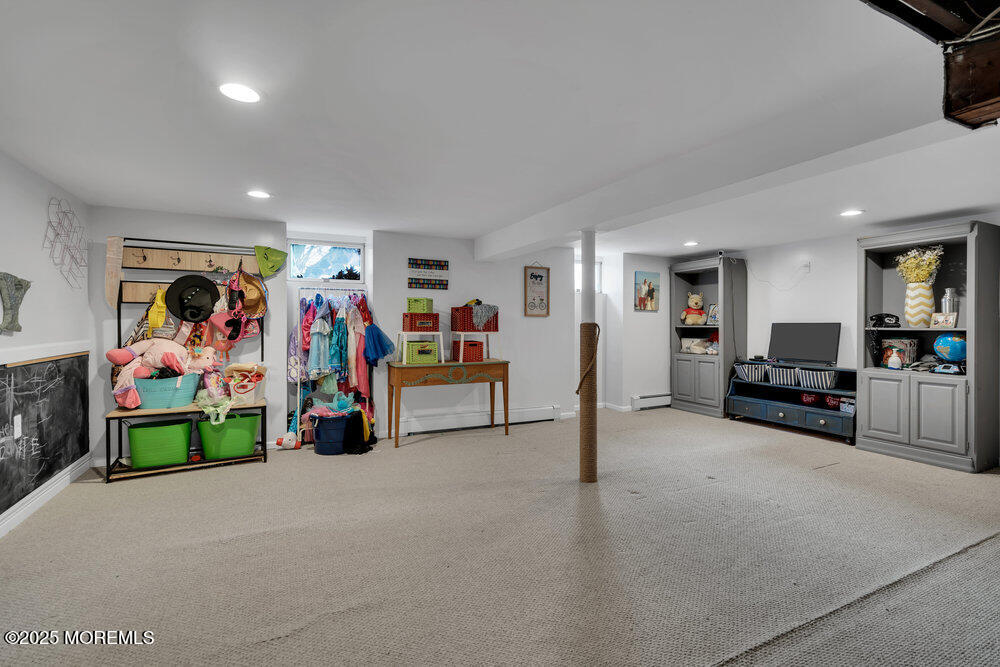 506 Crestview Terrace Point Pleasant, NJ 08742 - Photo 16 of 24 a view of a livingroom with furniture and a flat screen tv