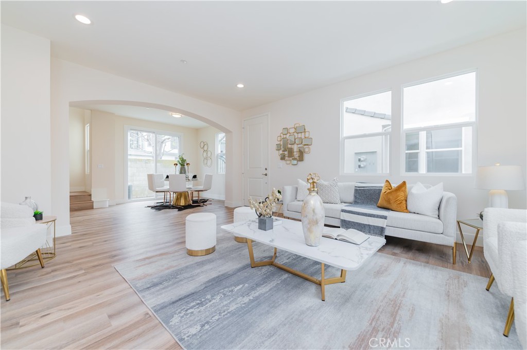11237 Gladhill Road, Unit 10 Whittier, CA 90604 - Photo 3 of 9 a living room with furniture and wooden floor