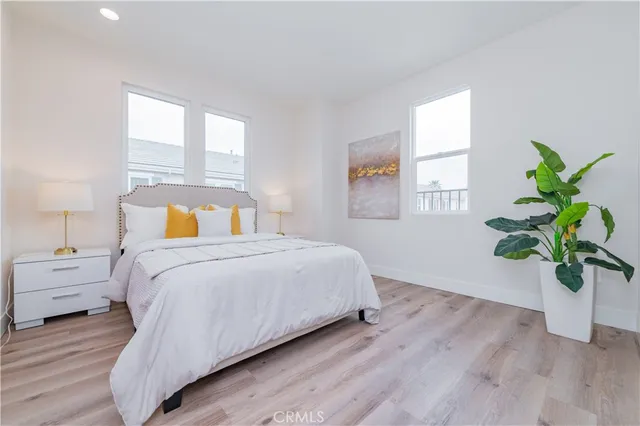 a bedroom with a bed running cycle and a window