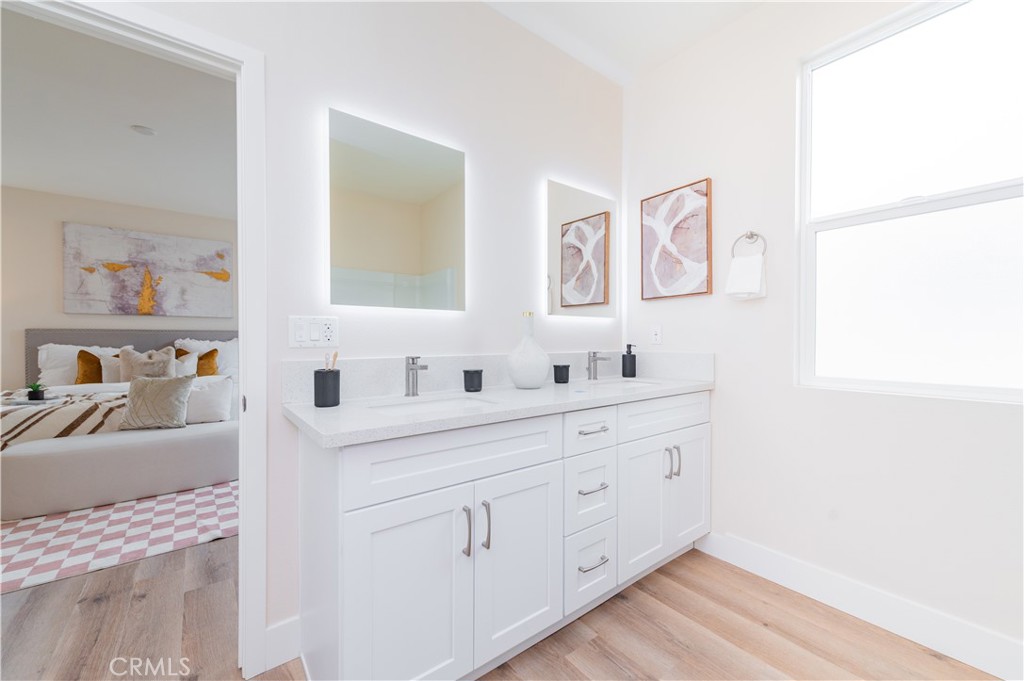 11237 Gladhill Road, Unit 10 Whittier, CA 90604 - Photo 8 of 9 a bathroom with a sink and a mirror