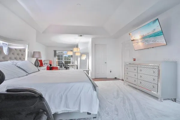 a white bath tub sitting in a bathroom and mirror