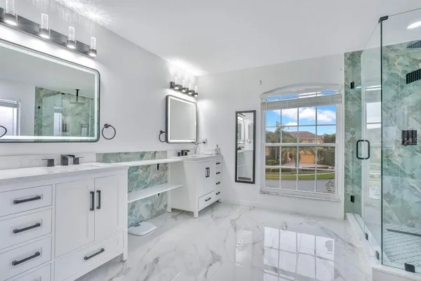 a bathroom with a sink a vanity and a mirror