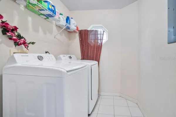 a view of a swimming pool with a patio