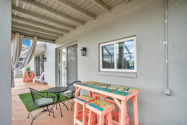 a view of a swimming pool with a patio