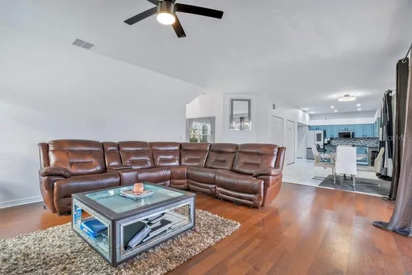 a living room with furniture and a fireplace