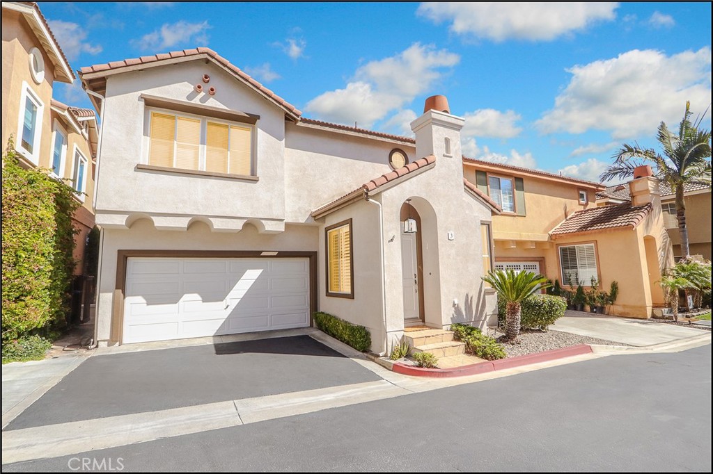 3 Delfin Aliso Viejo, CA 92656 - Photo 1 of 23 a view of a white house with large windows