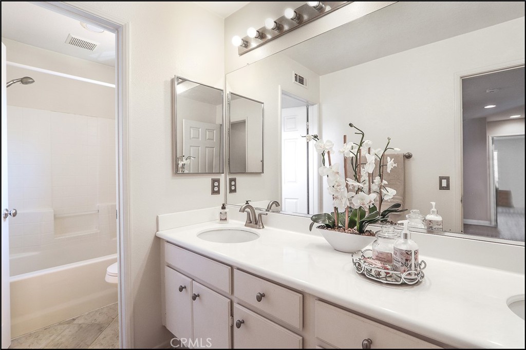 3 Delfin Aliso Viejo, CA 92656 - Photo 17 of 23 a bathroom with a double vanity sink window and a mirror