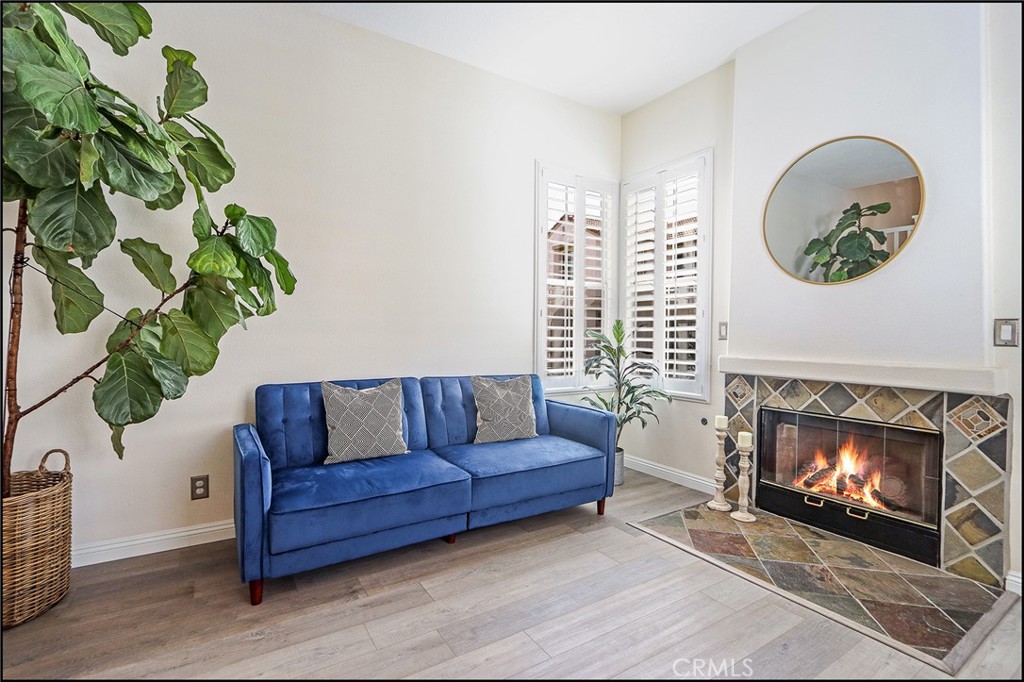 3 Delfin Aliso Viejo, CA 92656 - Photo 3 of 23 a living room with furniture and a fireplace