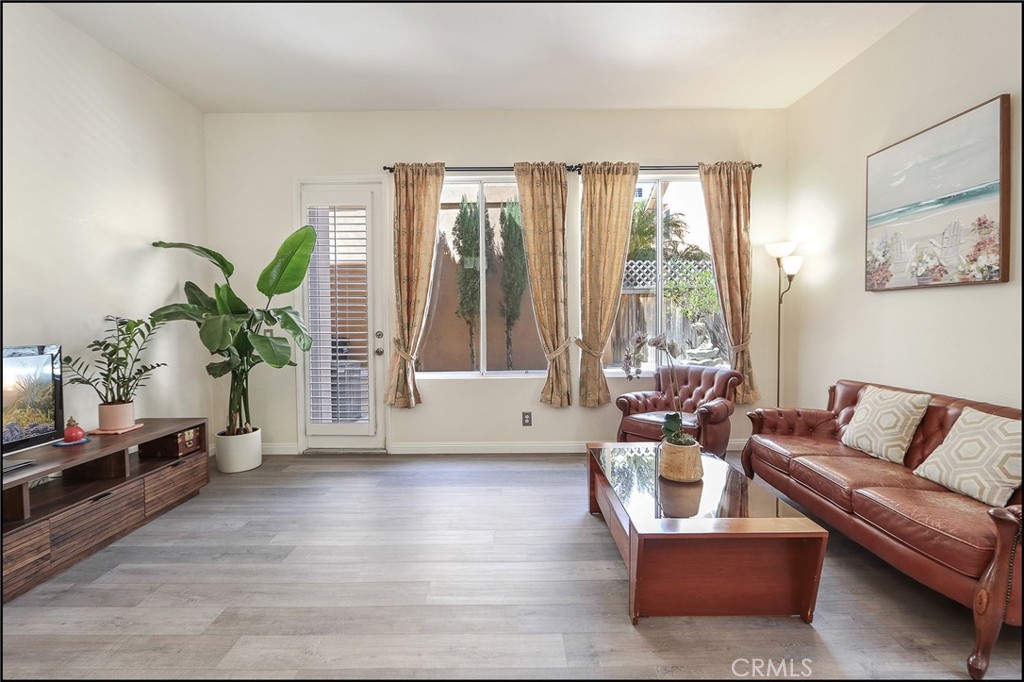 3 Delfin Aliso Viejo, CA 92656 - Photo 8 of 23 a living room with furniture and a large window