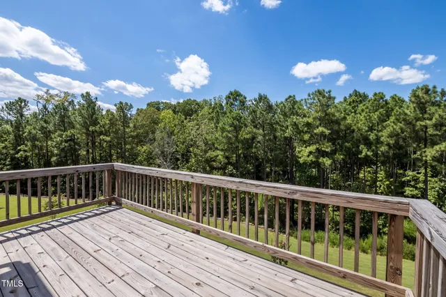 a view of a balcony with wooden floor