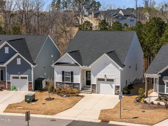 a view of a house with outdoor seating