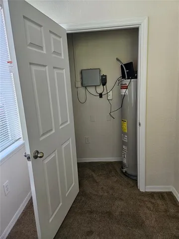 a view of a hallway with wooden floor and a hallway