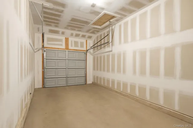 a view of an empty room with stairs