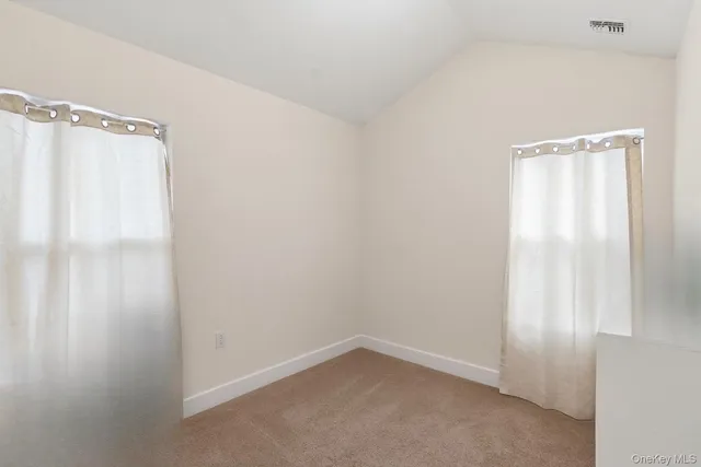 a bedroom with a bed and a cabinets