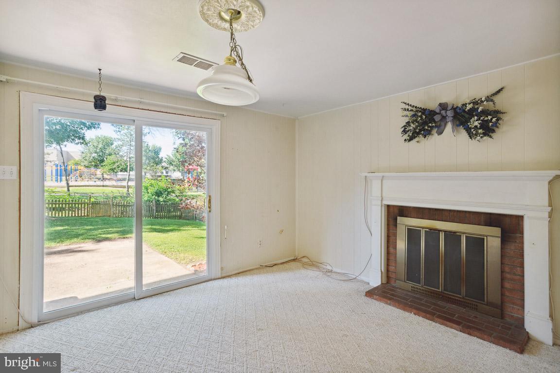 13639 Stepney Lane Chantilly, VA 20151 - Photo 20 of 33 Walkout Level Rec Room with Wood Burning Fireplace
