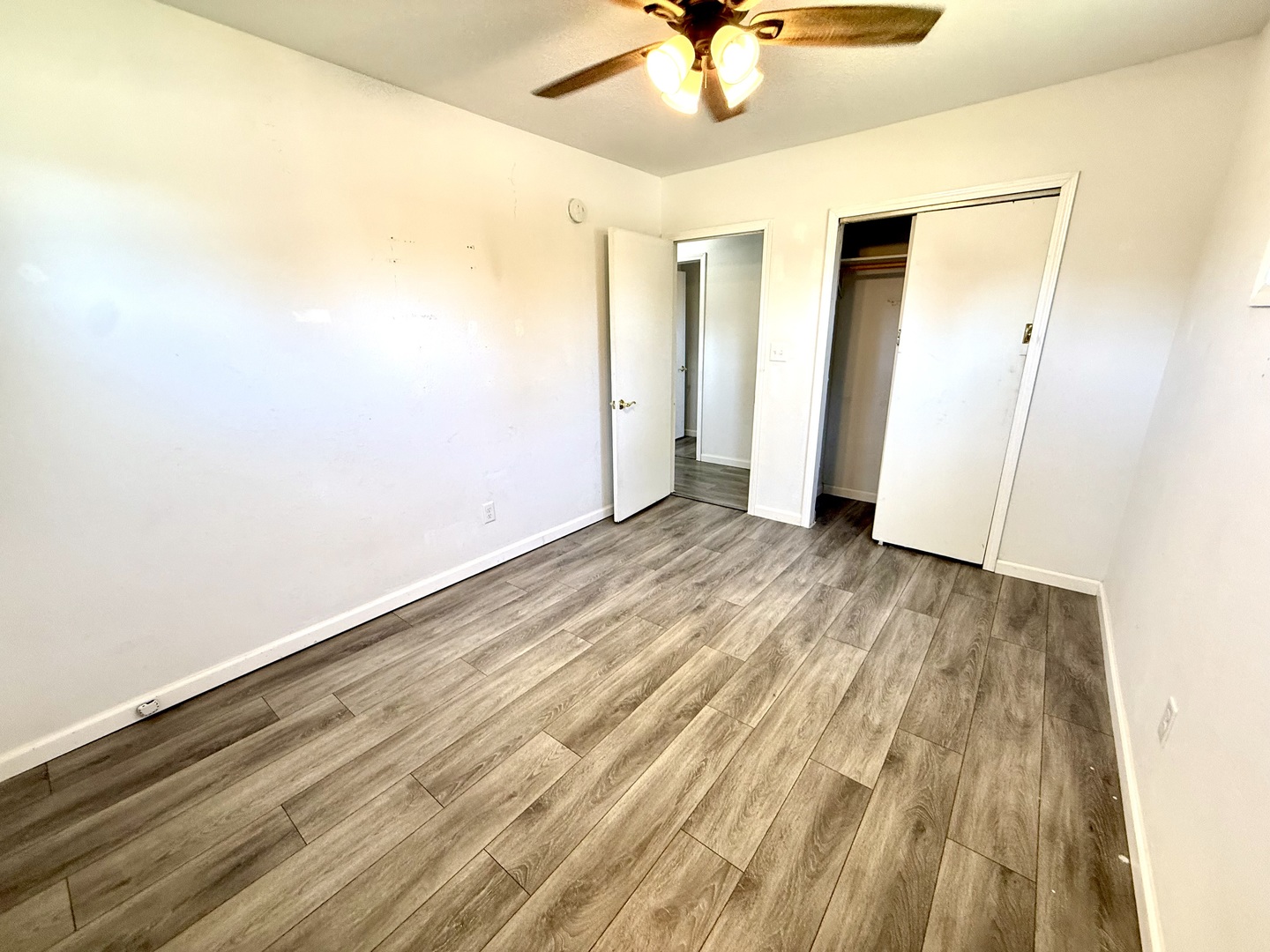 207 East Illinois Street Cambridge, IL 61238 - Photo 13 of 29 wooden floor in an empty room