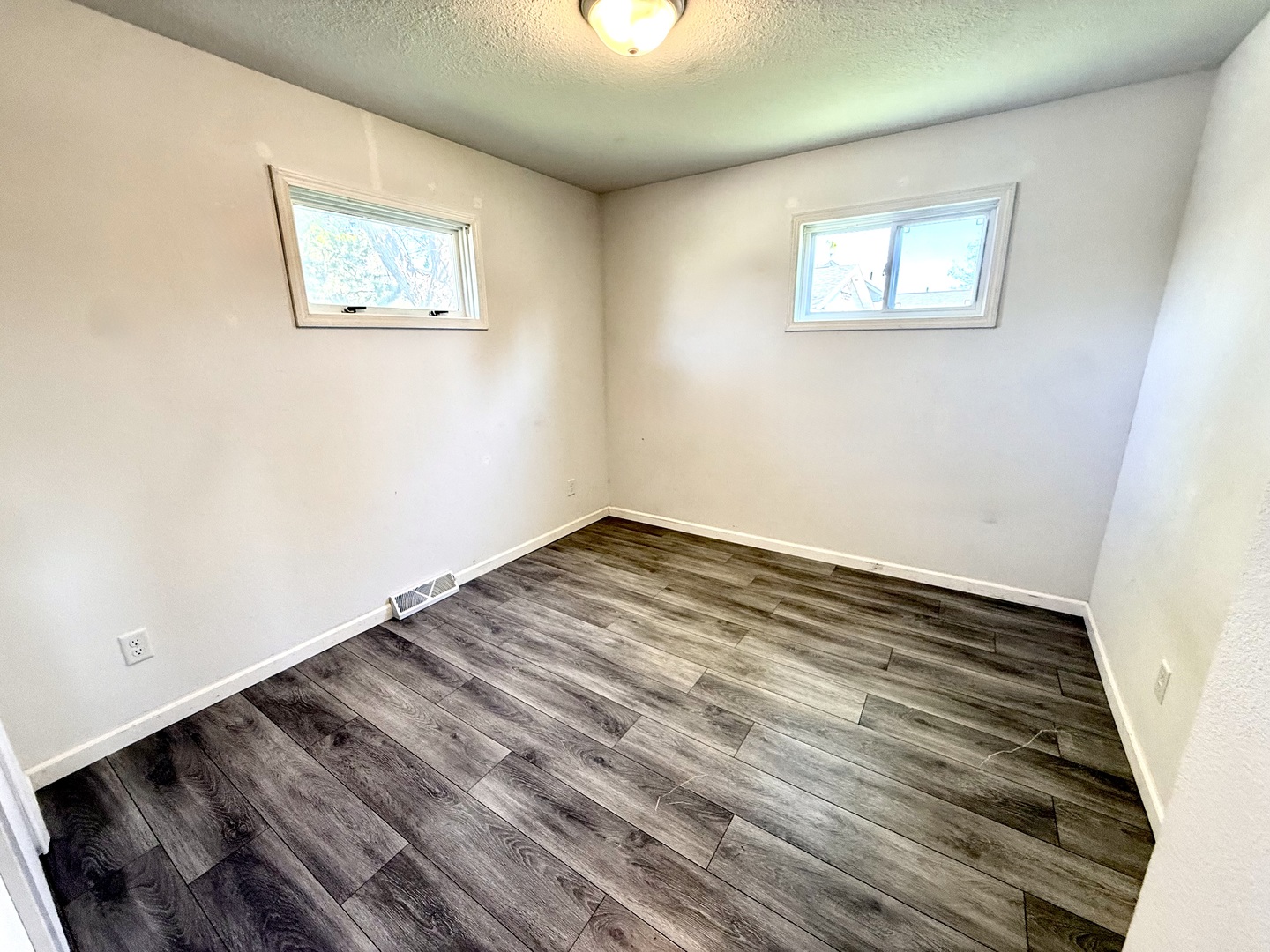 207 East Illinois Street Cambridge, IL 61238 - Photo 14 of 29 a view of a room with wooden floor and window