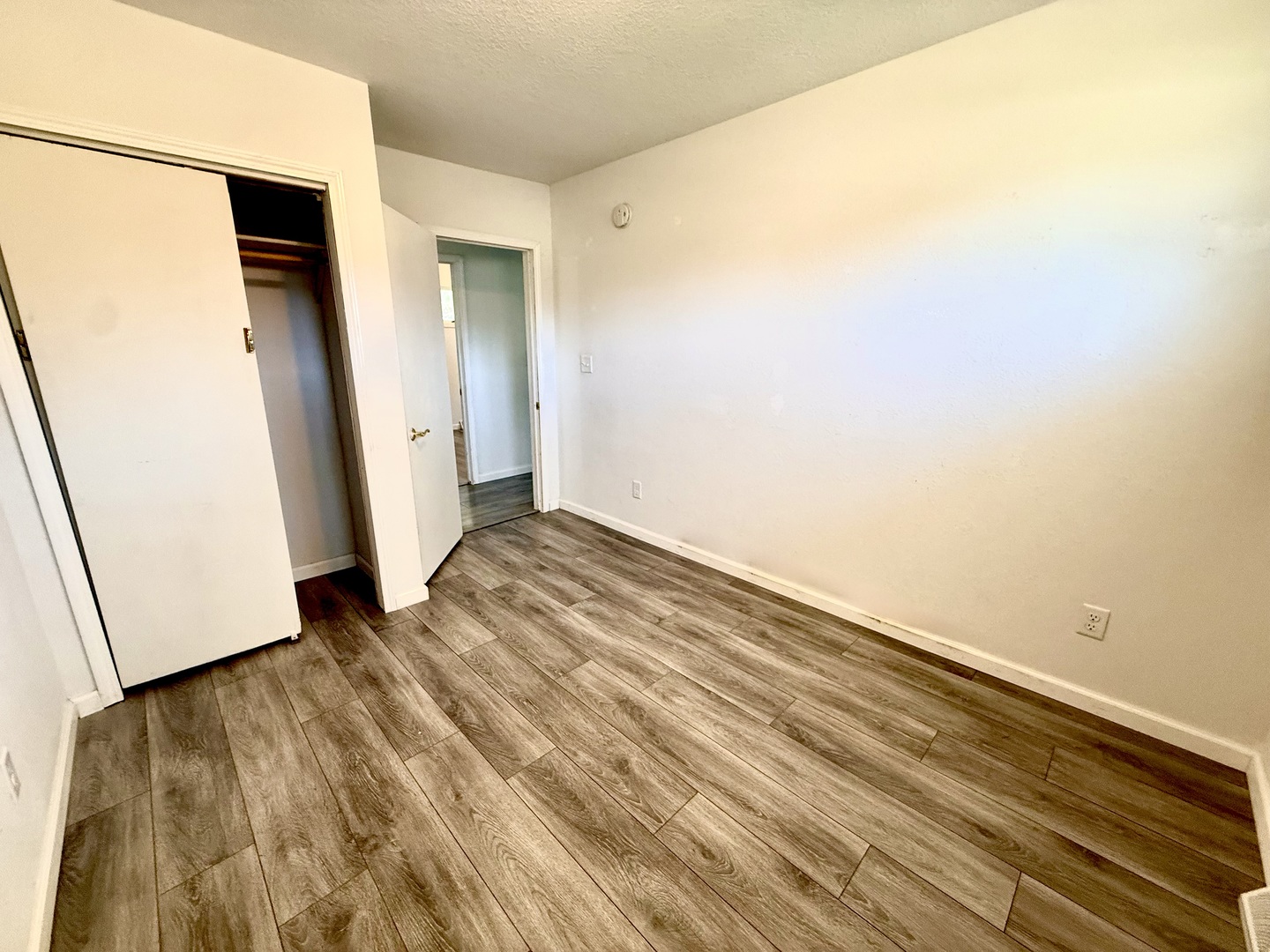 207 East Illinois Street Cambridge, IL 61238 - Photo 18 of 29 an empty room with wooden floor and entrance