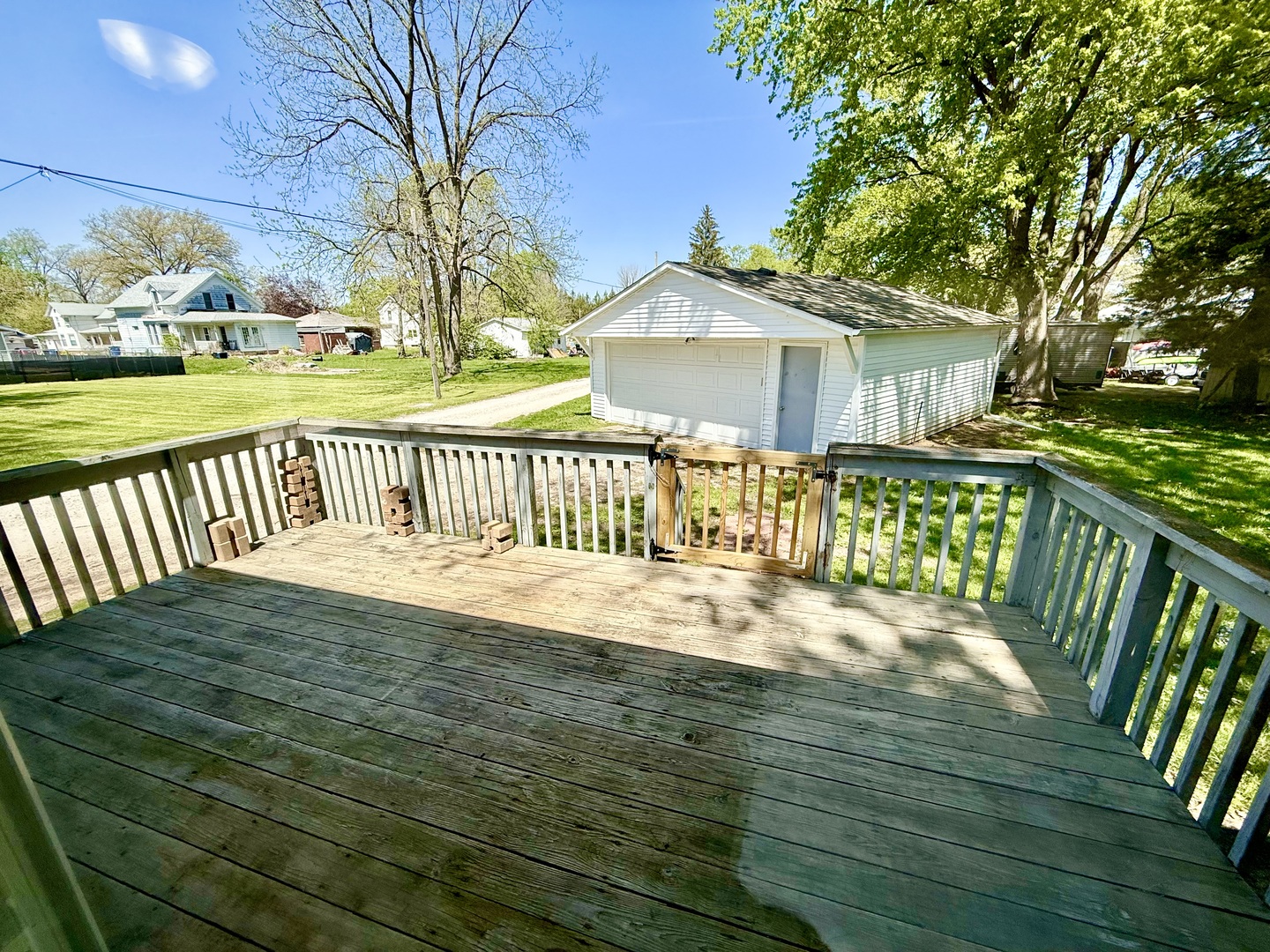 207 East Illinois Street Cambridge, IL 61238 - Photo 21 of 29 a view of a house with a wooden deck