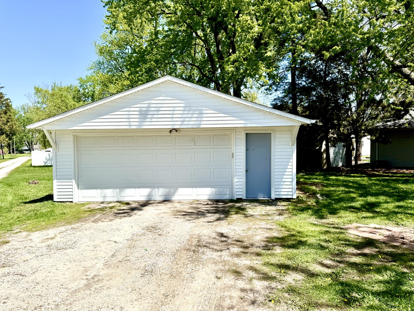 207 East Illinois Street Cambridge, IL 61238 - Photo 24 of 29 a front view of a house with a yard and garage