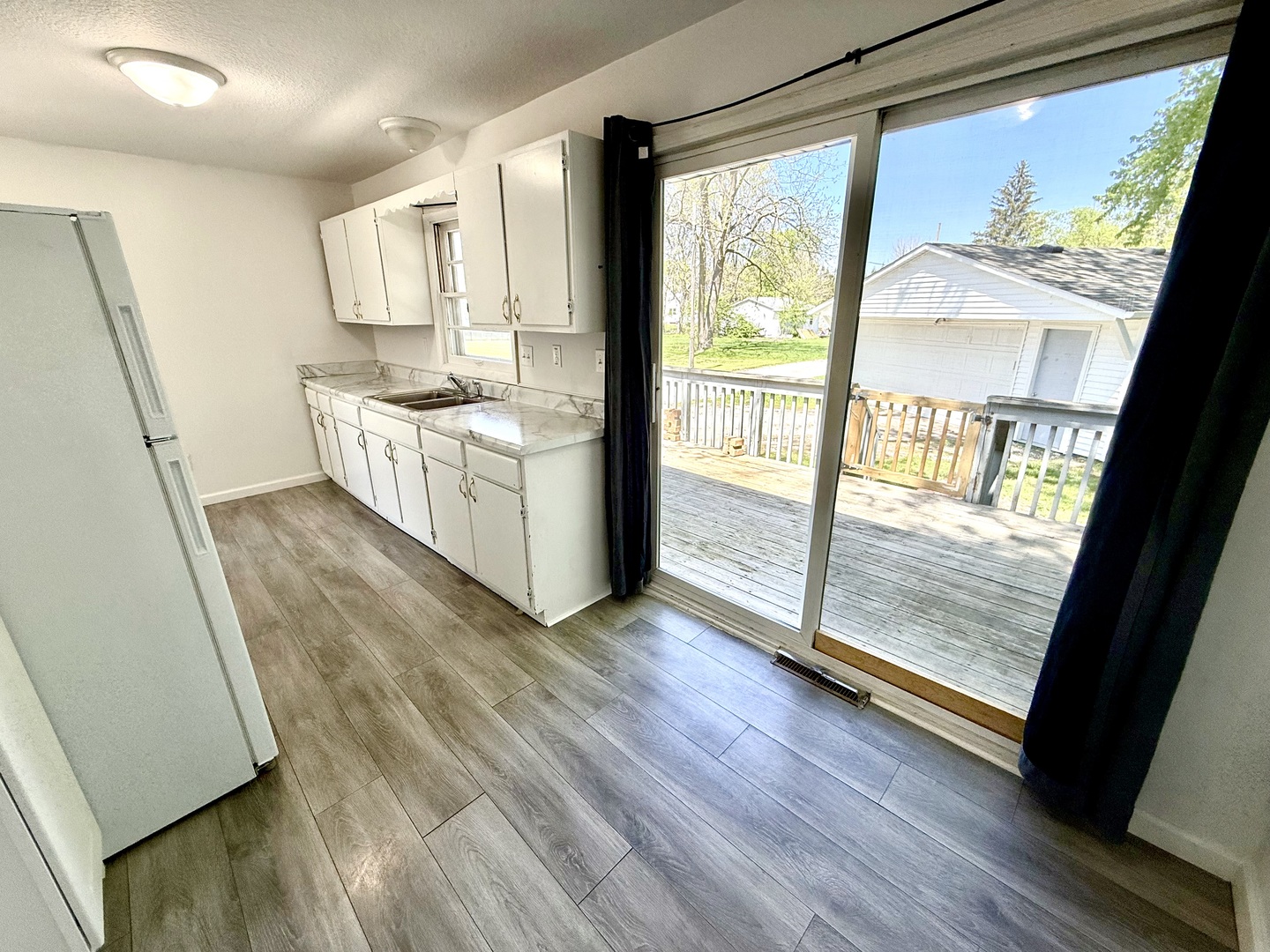 207 East Illinois Street Cambridge, IL 61238 - Photo 6 of 29 a view of a kitchen with wooden floor and floors