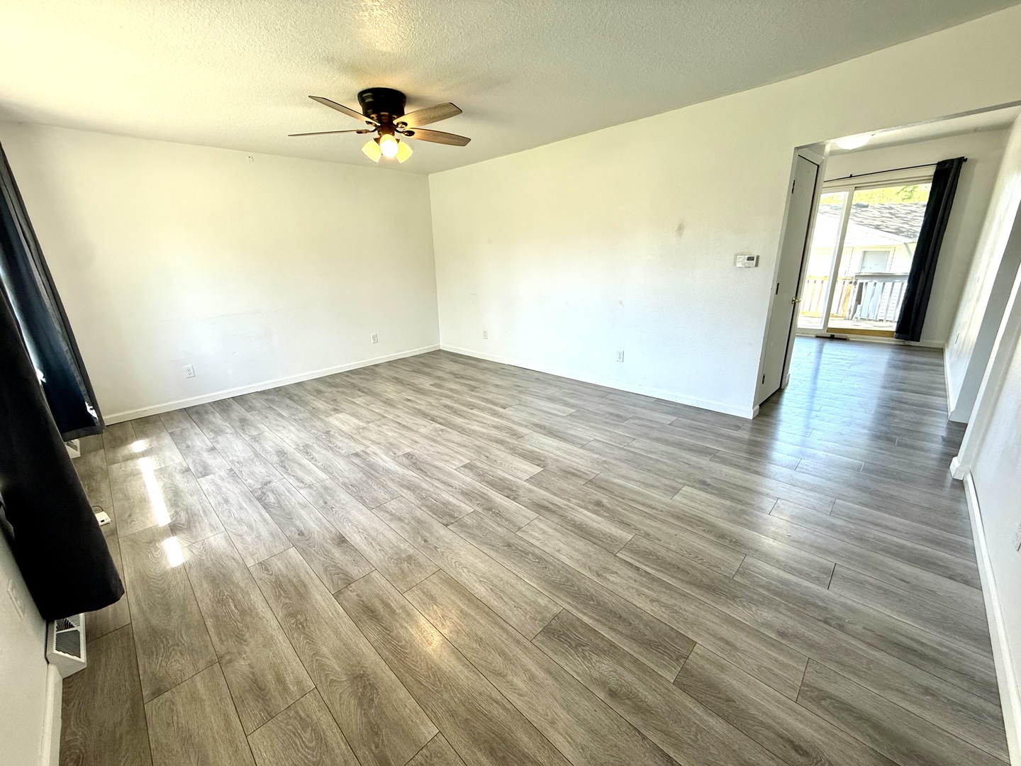 207 East Illinois Street Cambridge, IL 61238 - Photo 10 of 29 wooden floor in an empty room with a window