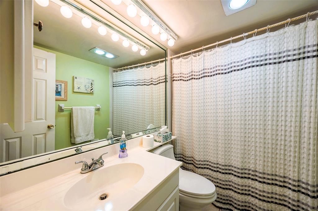 6777 Winkler Road, Unit 150 Fort Myers, FL 33919 - Photo 19 of 48 a bathroom with a sink a toilet and shower
