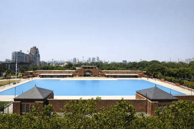 a view of a swimming pool with lounge chair