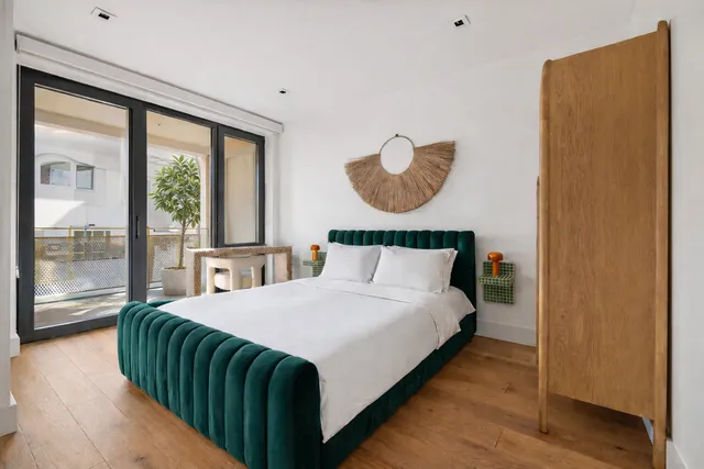 a bedroom with a bed and window