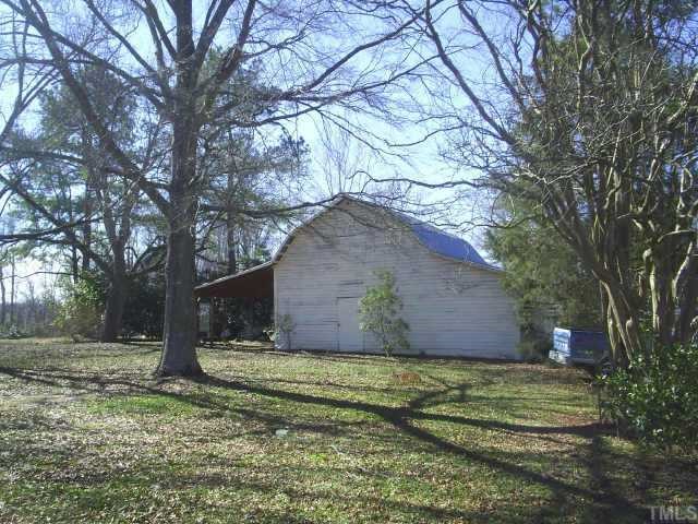 6564 Dwight Rowland Road Willow Spring, NC 27592 - Photo 2 of 6 a view of a house with a yard
