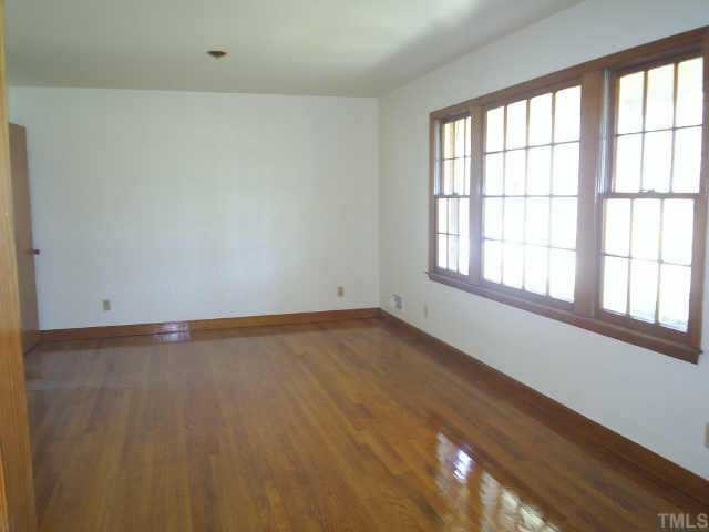 6564 Dwight Rowland Road Willow Spring, NC 27592 - Photo 3 of 6 a view of an empty room with a window