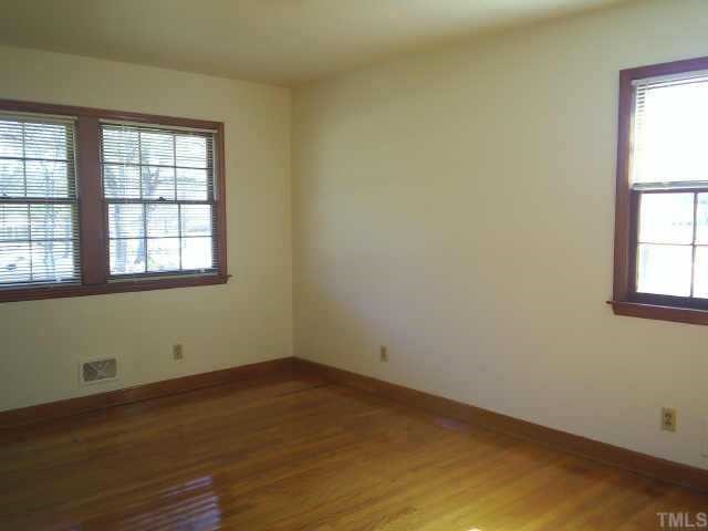 6564 Dwight Rowland Road Willow Spring, NC 27592 - Photo 5 of 6 an empty room with a window