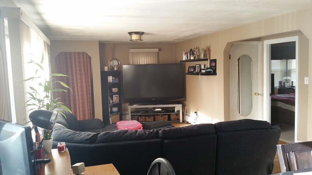6 Anna Terrace Methuen, MA 01844 - Photo 4 of 11 a living room with furniture and a flat screen tv