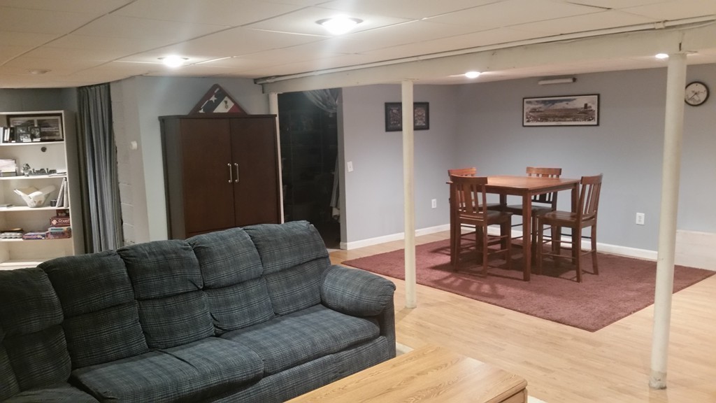 6 Anna Terrace Methuen, MA 01844 - Photo 9 of 11 a living room with furniture and a dining table with kitchen view