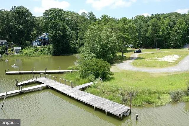 a view of a lake with houses in the back