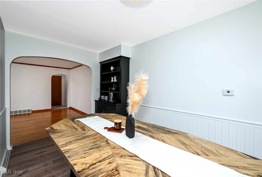 351 North Messner Road Akron, OH 44319 - Photo 14 of 44 *EAT IN KITCHEN W/BLACK CHINA CABINET, BLACK/GOLD TEXTURED HARDWARE, WAINSCOTING, LUXURY PLANK FLOORING & SLIDERS TO THE BACK PATIO ~