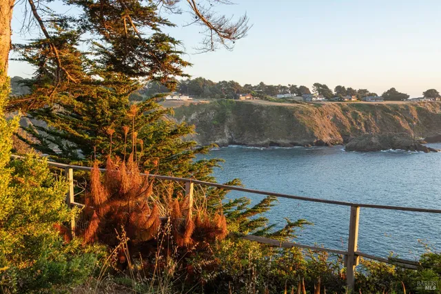 a kitchen with stainless steel appliances kitchen island granite countertop a refrigerator and a stove